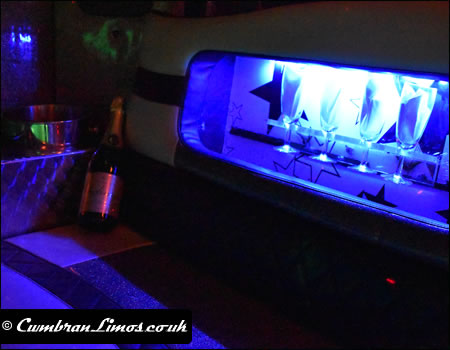 Bottles of chilled bubbly and clean set of glasses